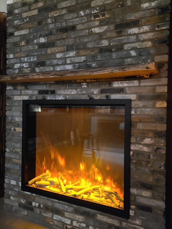 AMANTII TRD-48 ELECTRIC FIREPLACE INSERT IN RECLAIMED BRICK WALL